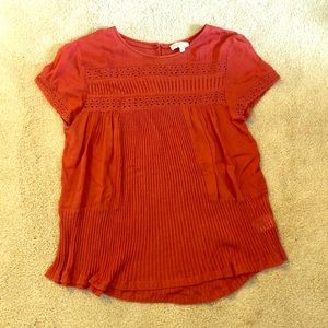 Rust/orange colored blouse